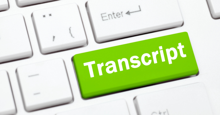 Medical transcriptionist typing on a keyboard with medical documents in the background